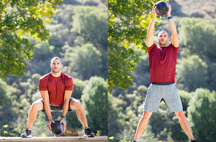 medicine ball squat with straight arm extension