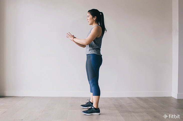 Woman doing squats for Fitbit's 30-Day Spring Training Challenge