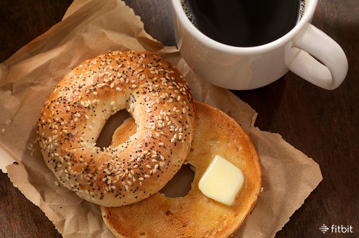 A bagel with butter for breakfast.