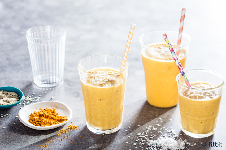 Healthy recipe for a golden tropical smoothie with mango and turmeric