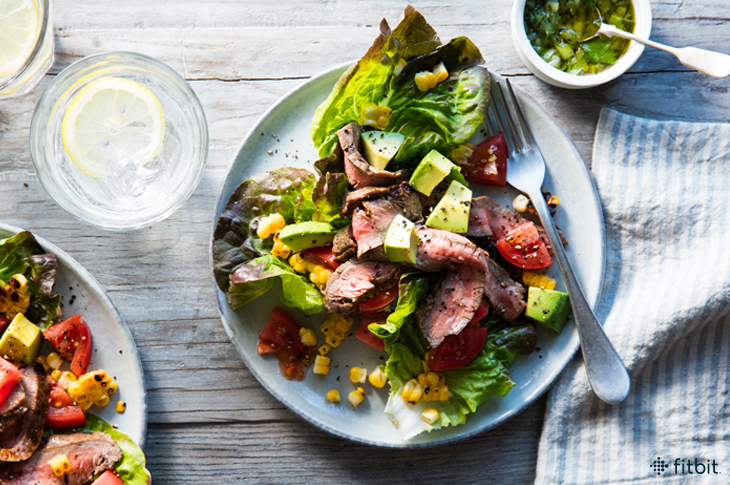 Healthy recipe for a grilled steak salad with corn and tomatoes
