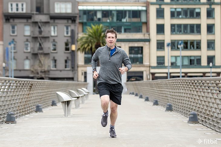 man running with his fitbit tracker.