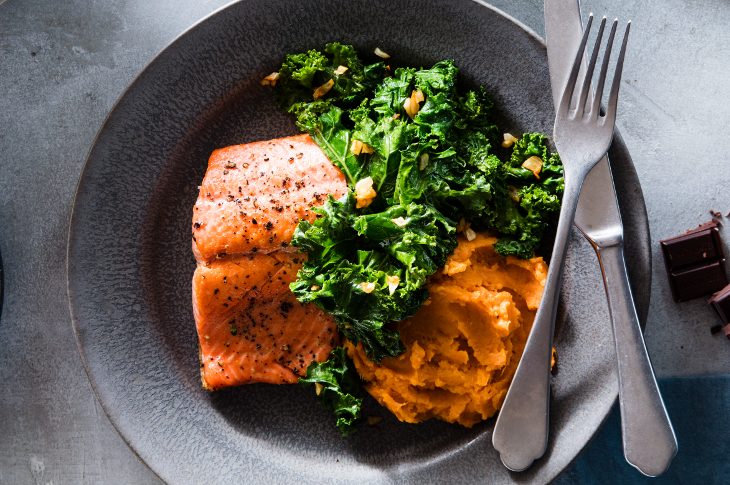 Healthy salmon recipe with sweet potatoes and kale