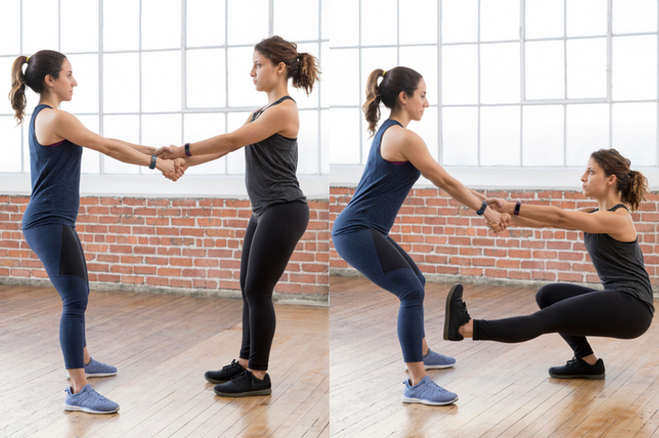 Use your partner for support in pistol squats.
