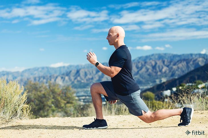 Fitbit ambassador and celebrity trainer Harley Pasternak demonstrating a lunge.